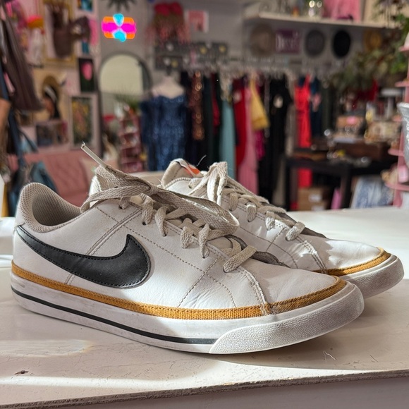 Nike Shoes - Nike White Sneakers with Black Swoosh and Gold Stripe